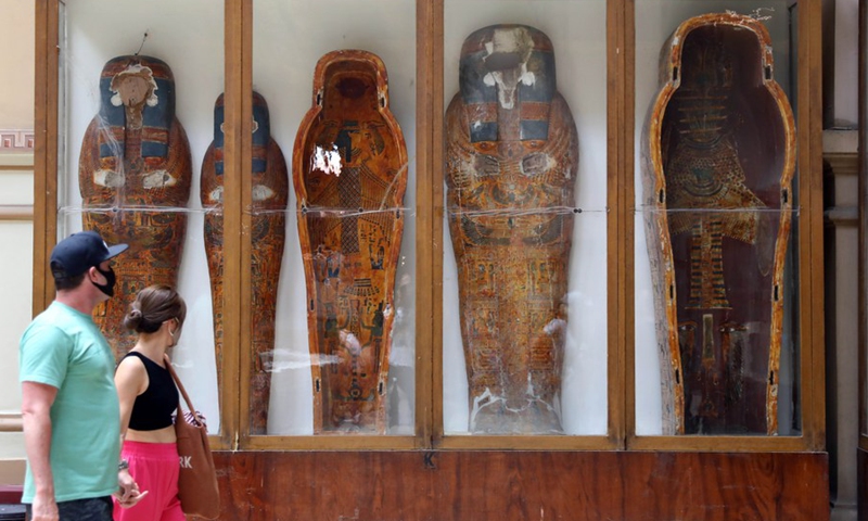 Tourists visit mummy coffins during the International Museum Day at the Egyptian Museum in Cairo, Egypt, on May 18, 2022.(Photo: Xinhua)