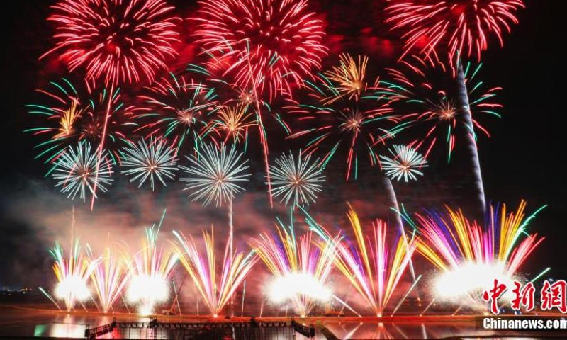 Fireworks illuminate the night sky during a commemorative event on the 1,401 birth anniversary of Li Tian, the founder of firecrackers in Shangli county, Pingxiang, Jiangxi Province, May 18, 2022. Having a history of fireworks production of more than 1,300 years , Shangli County of Jiangxi is regarded as the birthplace of China’s fireworks and crackers. (Photo: China News Service/Liu Yunchi)