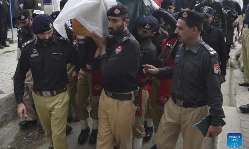 Policemen carry the casket of their colleague during a funeral in Peshawar, Pakistan, on May 19, 2022. Two policemen including an officer were killed in a terrorist attack in Pakistan's northwestern Khyber Pakhtunkhwa province on Thursday, police and rescue teams said.(Photo: Xinhua)