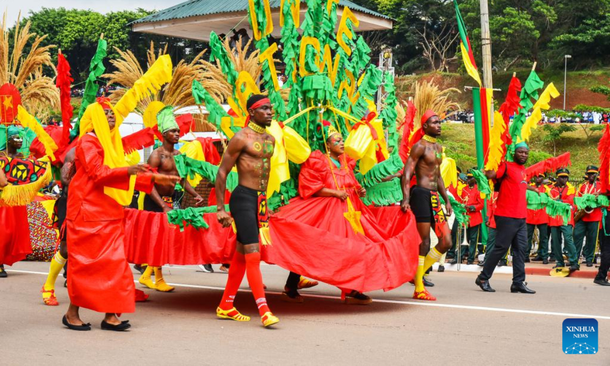 People take part in a parade to celebrate the National Day in Yaounde, Cameroon, on May 20, 2022. Cameroon marked on Friday the 50th anniversary of its National Day with a military and civilian parade for the first time since the first case of coronavirus was detected in the Central African nation in March 2020. Photo:Xinhua