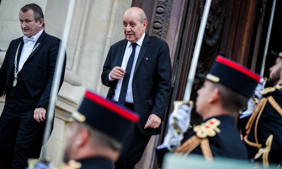 Outgoing French Foreign Affairs Minister Jean-Yves Le Drian (C) leaves the ministry at the end of a handover ceremony at Foreign Affairs Ministry in Paris, on May 21, 2022. Photo: AFP