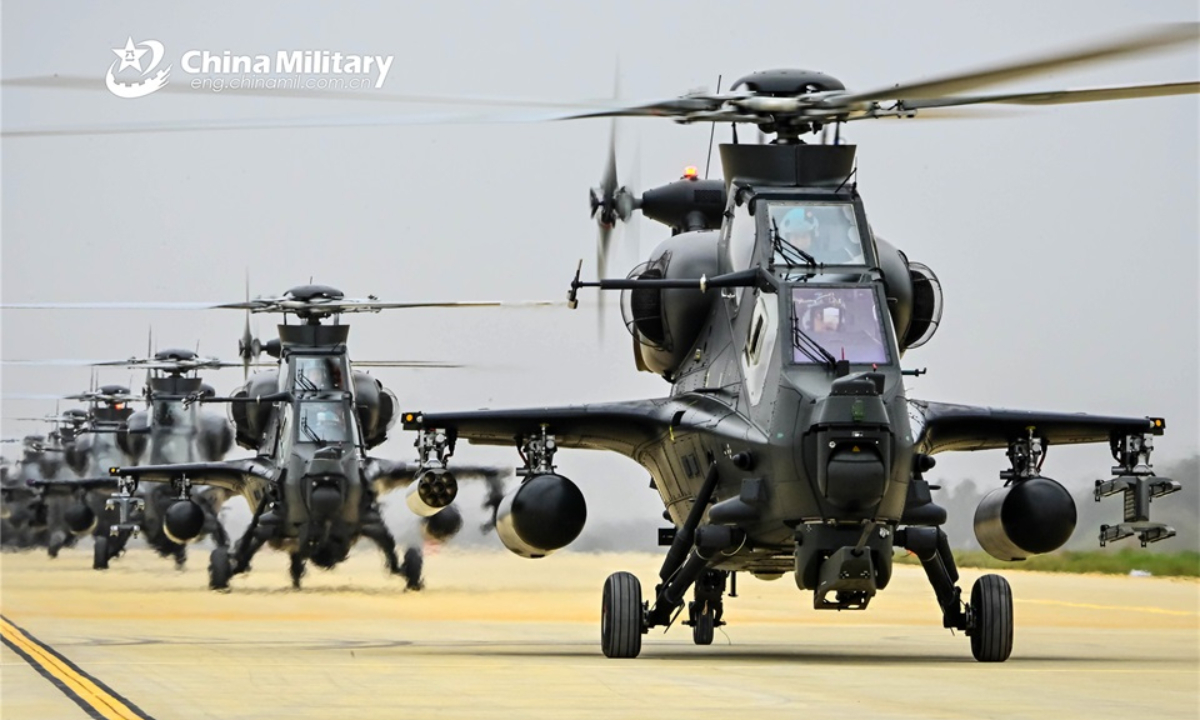 WZ-10 attack helicopters attached to an army aviation brigade under the PLA 73rd Group Army lift off for a flight training exercise on May 10, 2022. The exercise focused on subjects such as emergency combat sortie, formation flight and firepower escort, aiming to beef up the troops' capability in complex conditions. Photo:China Military