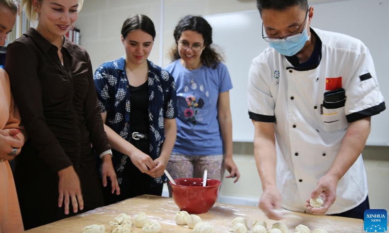 Students learn to make red bean buns during an event on Chinese medicine and culture in Msida, Malta, on May 20, 2022.Photo:Xinhua
