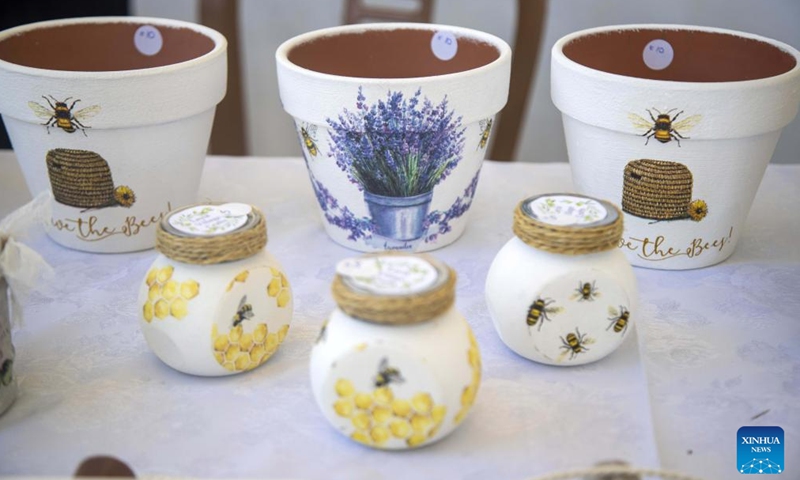Handmade crafts with bee designs are seen at a bee festival in Ora village in Larnaca, Cyprus, on May 22, 2022.Photo:Xinhua