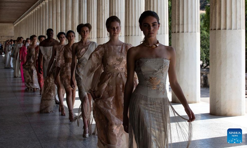 Models present creations of Greek fashion designer Vassilios Kostetsos at the Stoa of Attalos in ancient Agora of Athens, Greece, on May 23, 2022.Photo:Xinhua