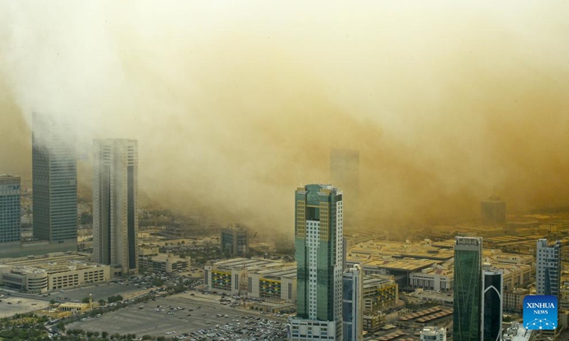 Photo taken on May 23, 2022 shows buildings shrouded in strong dust storm in Kuwait City, Kuwait.Photo:Xinhua