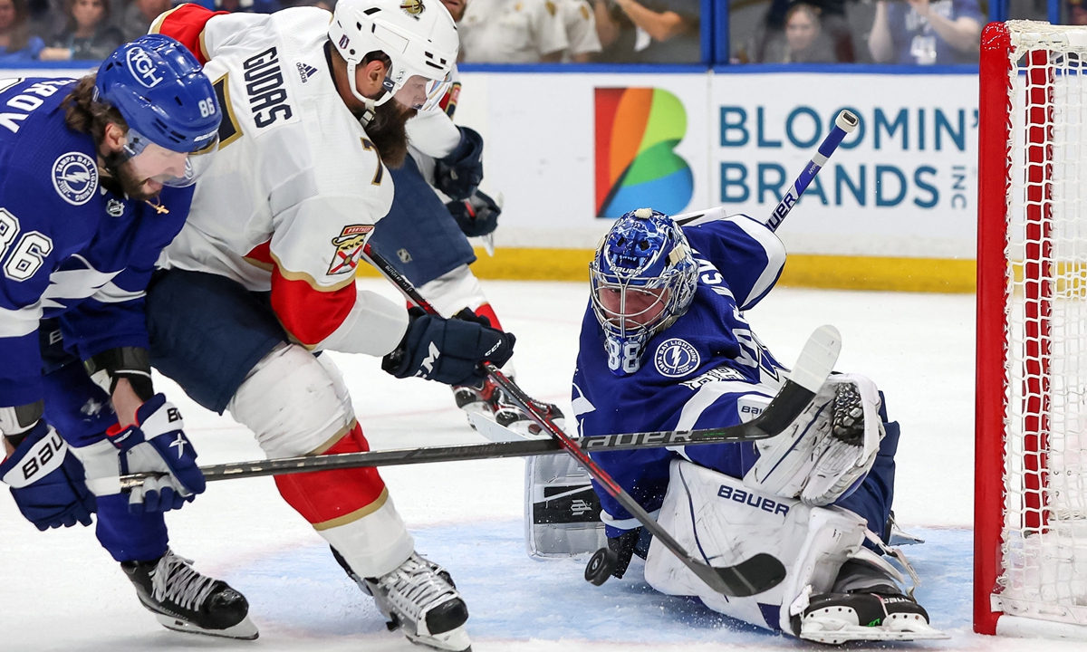 Andrei Vasilevskiy (right) of the Tampa Bay Lightning makes a save against the Florida Panthers on May 23, 2022 in Tampa, Florida. Photo: AFP