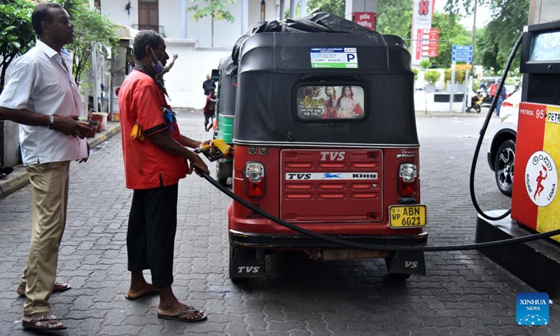 People fuel motorcycles at a gas station in Colombo, Sri Lanka, on May 24, 2022. Sri Lanka's state-owned Ceylon Petroleum Corporation has once again increased its fuel prices from Tuesday morning as the fuel shortage continues in the country.(Photo: Xinhua)