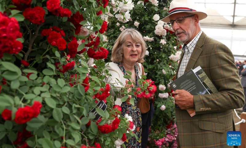 People enjoy a floral display at the RHS (Royal Horticultural Society) Chelsea Flower Show in London, Britain, on May 24, 2022. The annual RHS Chelsea Flower Show opened to the public on Tuesday.(Photo: Xinhua)