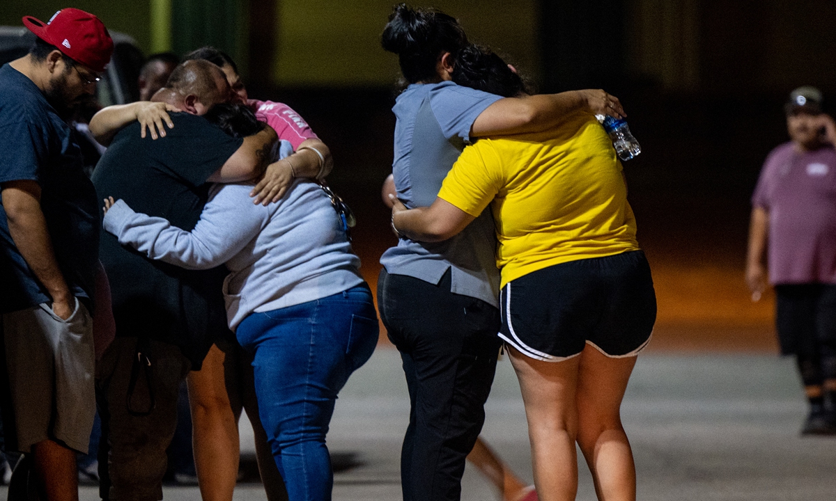 A family grieves outside of the SSGT Willie de Leon Civic Center following the mass shooting at Robb Elementary School on May 24, 2022 in Uvalde, Texas. According to reports, 19 students and 2 adults were killed, with the gunman fatally shot by law enforcement.Photo: AFP