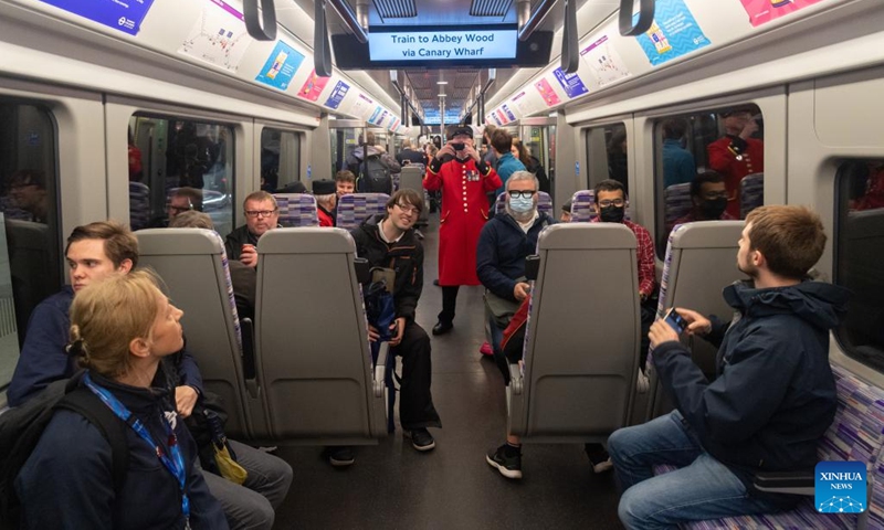 Passengers travel on a train of Elizabeth Line on the first day of its opening to the public in London, Britain, on May 24, 2022. As a new railway line, Elizabeth Line opened to the public on Tuesday.(Photo: Xinhua)