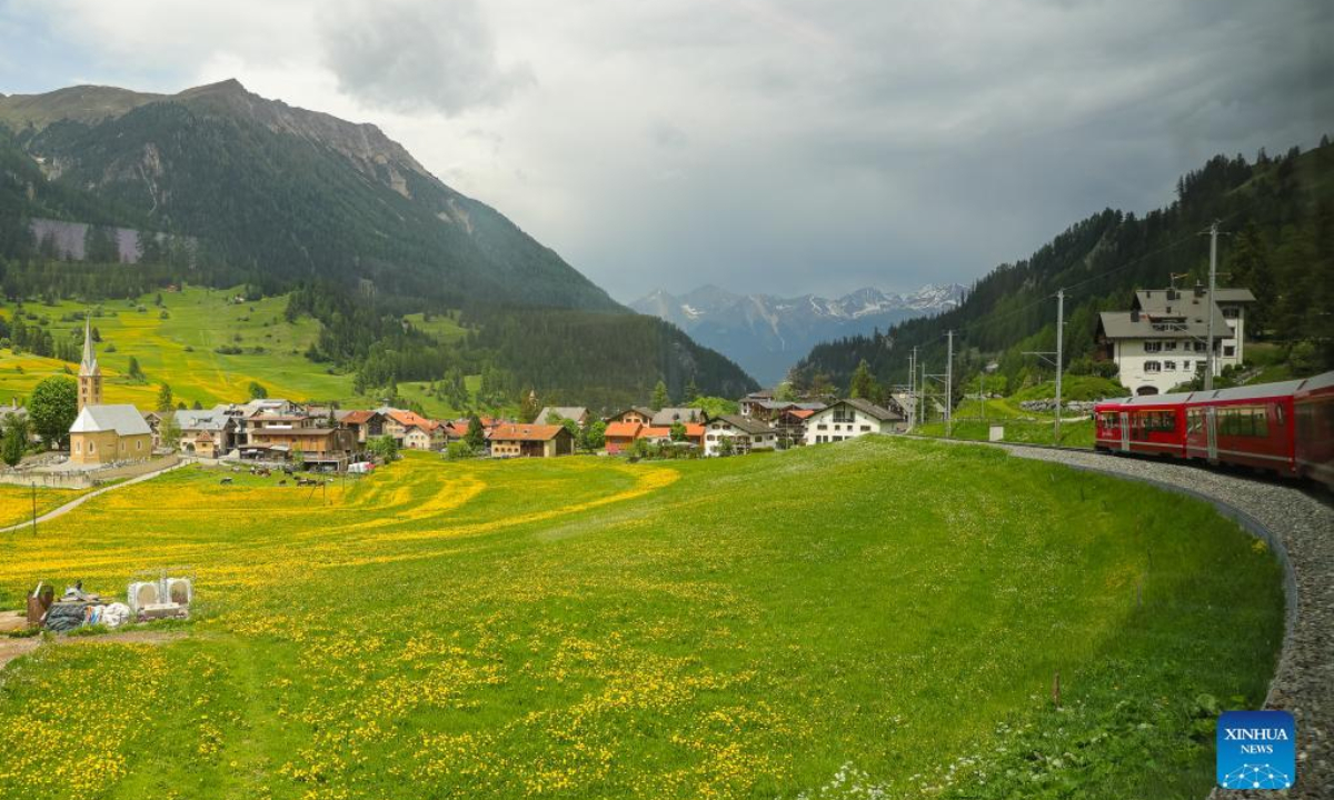 A train runs on the Rhaetian Railway in the Albula/Bernina landscapes in Switzerland, May 22, 2022. The Rhaetian Railway in the Albula/Bernina landscapes was included in the UNESCO World Heritage List in 2008. Photo:Xinhua