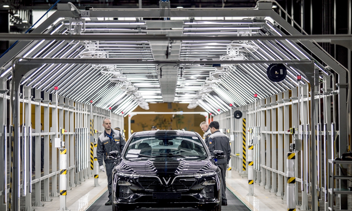 A VinFast Lux A 2.0 sedan moves through the final inspection area of the assembly line at the automaker's plant in Vietnam. Photo: VCG