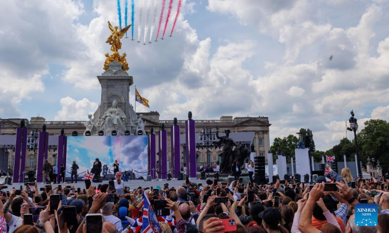 People watch the fly-past after the Trooping the Colour parade in celebration of Britain's Queen Elizabeth II's Platinum Jubilee, in London, Britain, on June 2, 2022. (Photo by Tim Ireland/Xinhua)