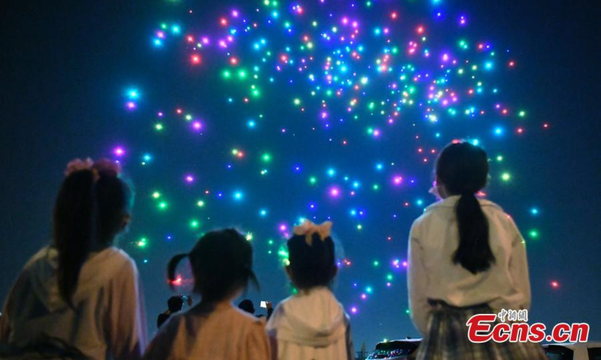 Illuminated drones stage a light show to celebrate the Children's Day in Tianjin, May 31, 2022. Photo:China News Service