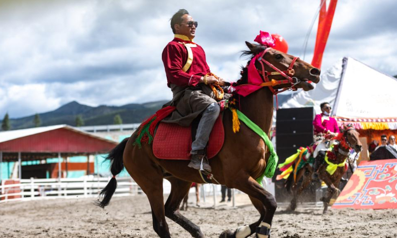 Riders perform equestrian show at a horse racing festival held in Shangri-La, Deqen Tibetan Autonomous Prefecture, southwest China's Yunnan Province, June 3, 2022. (Xinhua/Cao Mengyao)