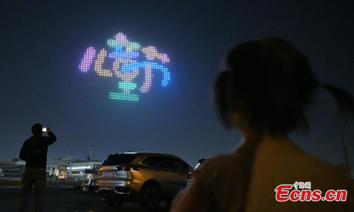 Illuminated drones stage a light show to celebrate the Children's Day in Tianjin, May 31, 2022. Photo:China News Service