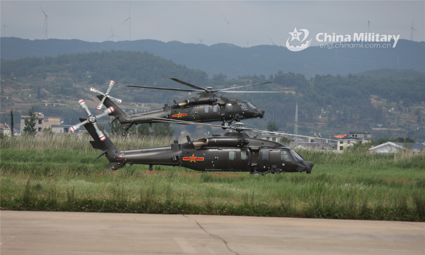 Attack helicopters attached to a brigade under the PLA 75th Group Army execute hovering inspections during a flight training exercise on May 26, 2022. (eng.chinamil.com.cn/Photo by Li Chunguo)