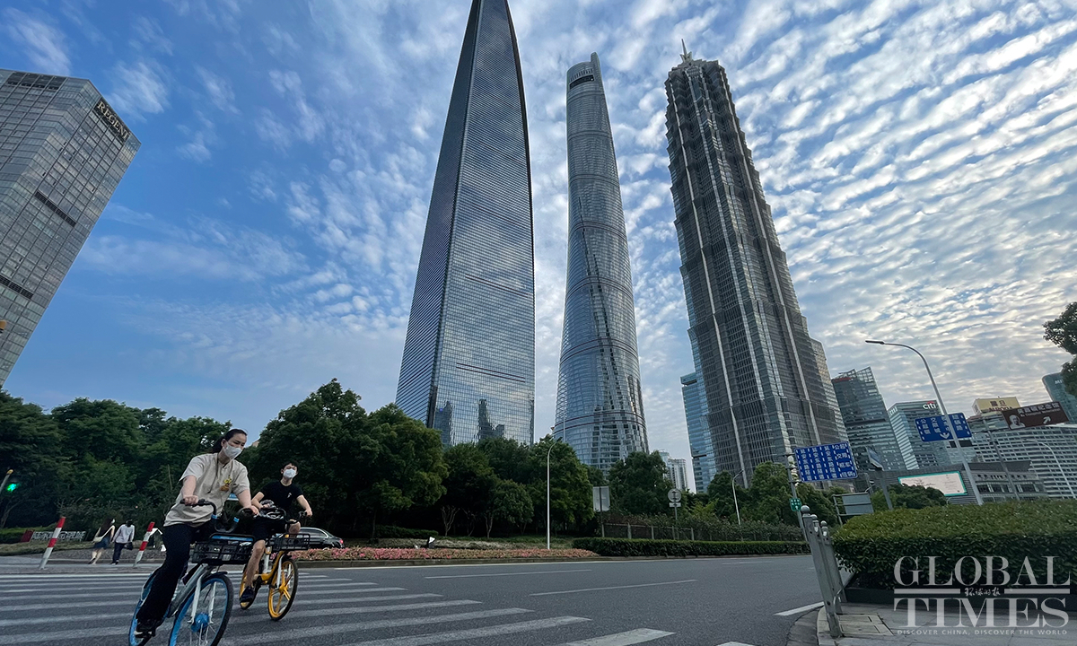 Two cyclists ride on a street of Pudong New Area, in East China's Shanghai, on May 31. Photo: Feng Yu/GT