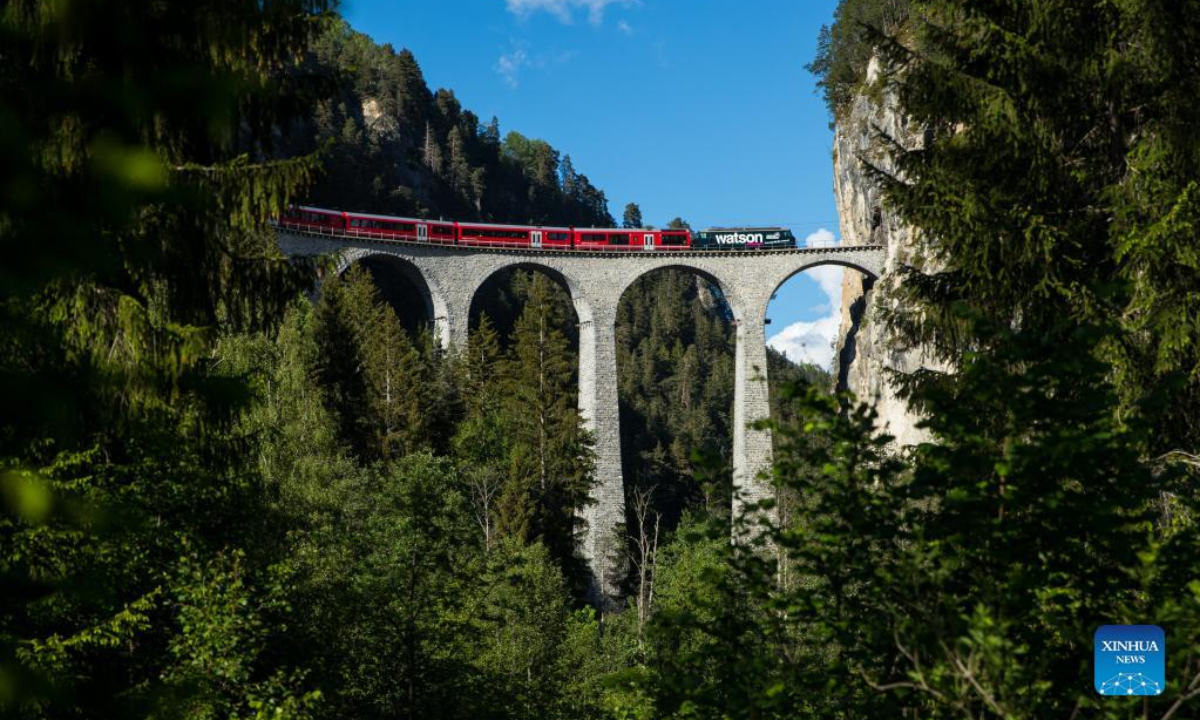 A train runs on the Rhaetian Railway in the Albula/Bernina landscapes in Switzerland, May 26, 2022. The Rhaetian Railway in the Albula/Bernina landscapes was included in the UNESCO World Heritage List in 2008. Photo:Xinhua