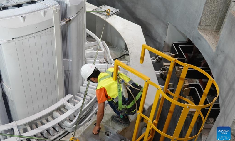 A Chinese constructor works for installing a 200-ton rotor on a generating unit at the Kokhav Hayarden pumped storage power plant in Beit She'an, Israel, on May 25, 2022.(Photo: Xinhua)