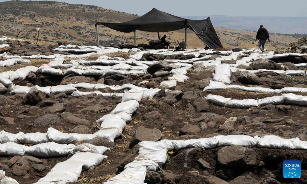 Staff members of the Israel Antiquities Authority (IAA) work at an excavation site next to Arbel stream near Tiberias, Israel, on May 26, 2022. Israeli archaeologists have discovered a well-preserved ancient agricultural farmstead, dated back to 2,100 years ago, the Israel Antiquities Authority (IAA) said on Wednesday. Photo:Xinhua