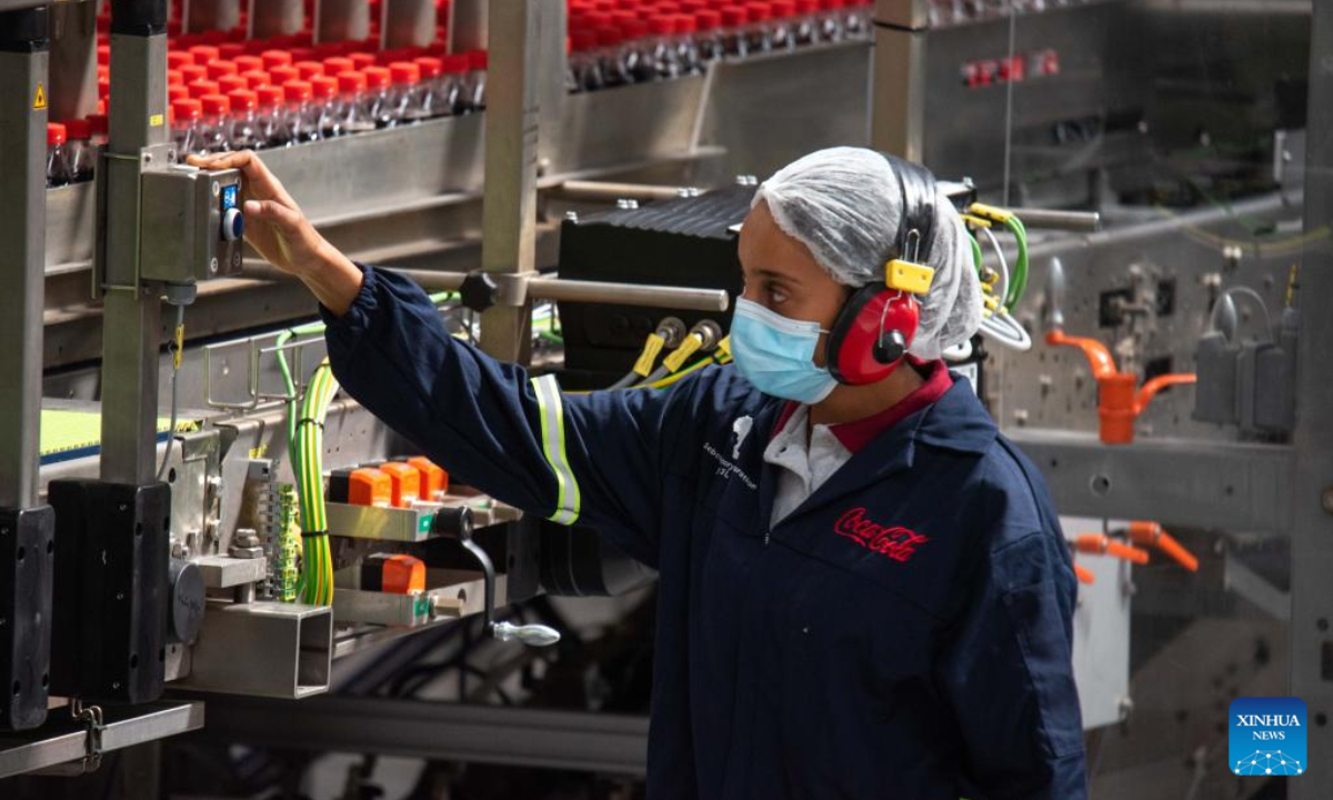 Employees work inside the Coca-Cola bottling plant in Sebeta town of Oromia regional state, Ethiopia, on May 31, 2022. The Coca-Cola Beverages Africa (CCBA) on Tuesday inaugurated its new 100 million US dollars Coca-Cola bottling plant in Ethiopia. Photo:Xinhua