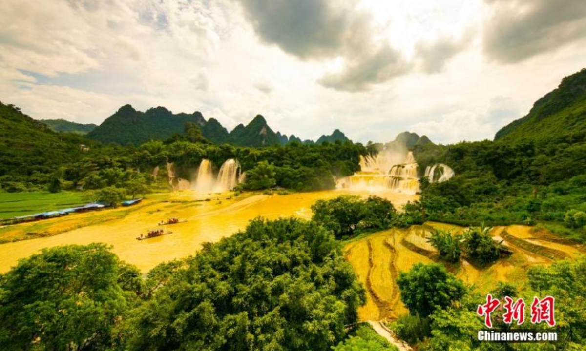Detian waterfall forms a rare golden waterfall under the sun light due to the soared water volume. May 26, 2022. Photo:China News Service