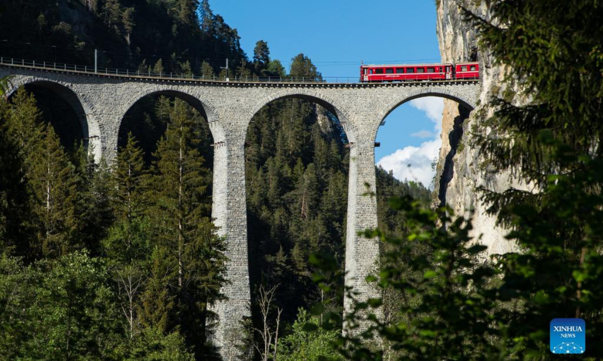 A train runs on the Rhaetian Railway in the Albula/Bernina landscapes in Switzerland, May 26, 2022. The Rhaetian Railway in the Albula/Bernina landscapes was included in the UNESCO World Heritage List in 2008. Photo:Xinhua