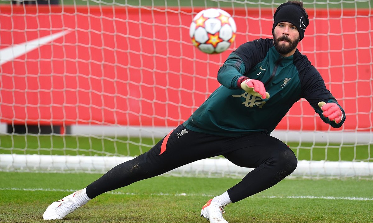 Alisson Becker of Liverpool makes a save during a training session on April 12, 2022 in Kirkby, England. Photo: VCG