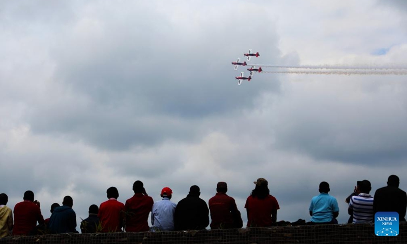 People watch aerobatic performance during the Museum Air Show Festival in Nairobi, Kenya, on May 28, 2022.Photo:Xinhua