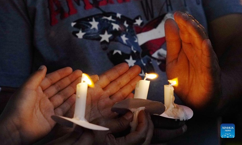 Candles are lit during a vigil to mourn for victims of a school mass shooting at Town Square in Uvalde, Texas, the United States, May 29, 2022. At least 19 children and two adults were killed in a shooting at Robb Elementary School in the town of Uvalde, Texas, on Tuesday. (Xinhua/Wu Xiaoling)