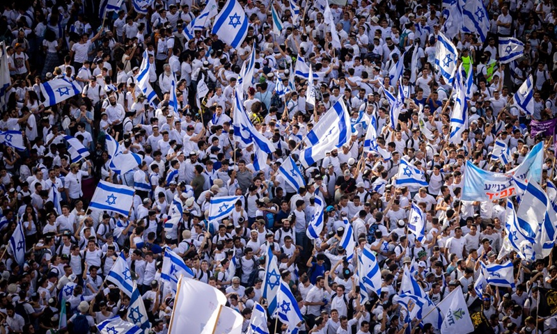 People take part in the flag march to mark Jerusalem Day outside the Damascus Gate in the Old City of Jerusalem, on May 29, 2022.Photo:Xinhua
