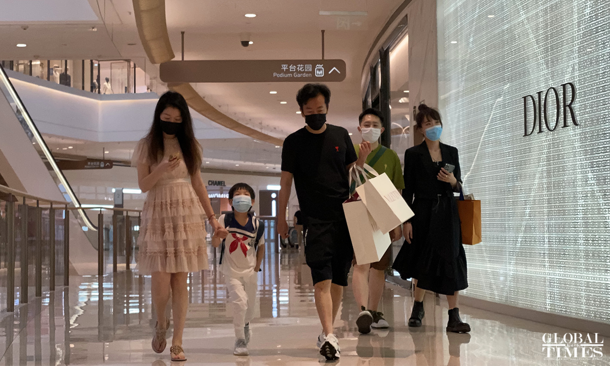The Plaza 66 shopping mall on Nanjing road in Shanghai resumed business on June 1. The flow of people has increased and there are long queues in front of some luxury stores. Photo: Chen Xia/GT