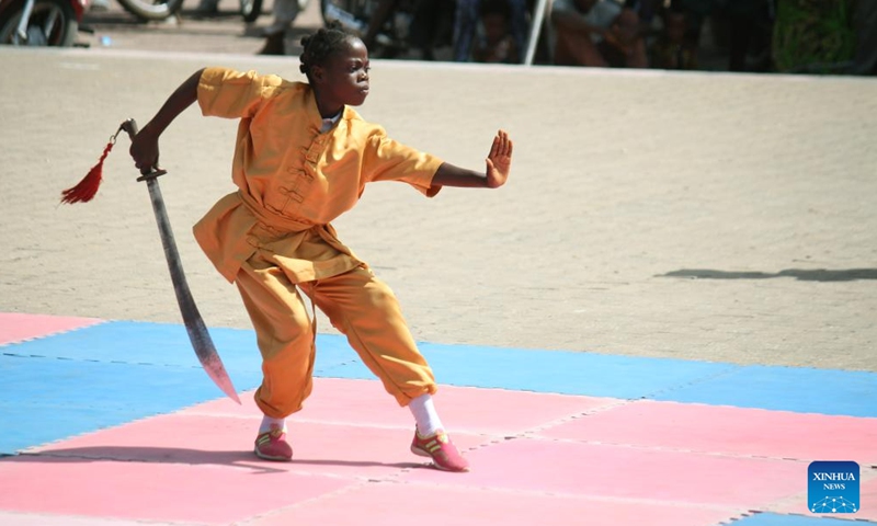 A girl performs martial arts during a graduation ceremony in Cotonou, Benin, May 29, 2022.Photo:Xinhua
