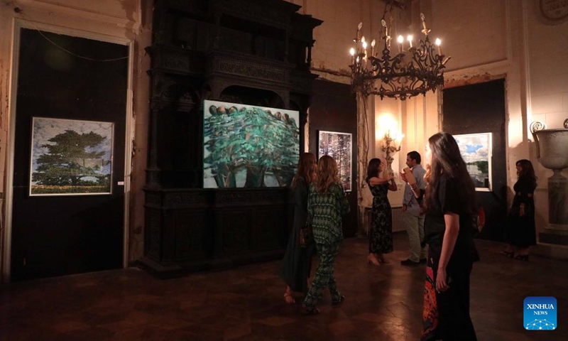 People visit a cedar art exhibition at Sursock Palace in Beirut, Lebanon, on May 30, 2022. The exhibition is aimed at raising funds to contribute to the restoration of Sursock Palace, which was damaged in the Beirut port explosions.(Photo: Xinhua)