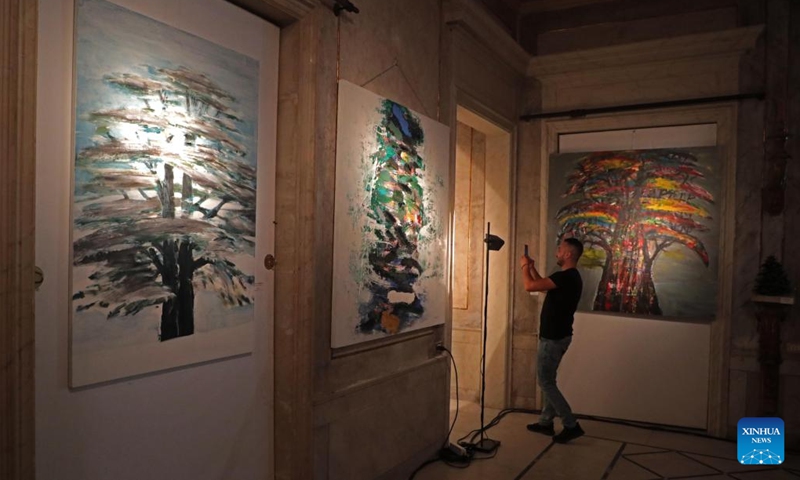 A man visits a cedar art exhibition at Sursock Palace in Beirut, Lebanon, on May 30, 2022. The exhibition is aimed at raising funds to contribute to the restoration of Sursock Palace, which was damaged in the Beirut port explosions.(Photo: Xinhua)