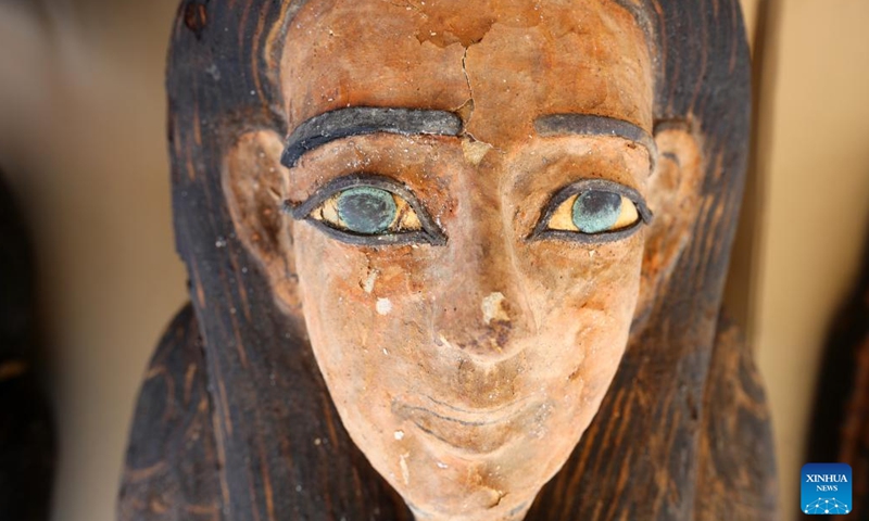 Photo taken on May 30, 2022 shows the face of a colored coffin containing a mummy during an archaeological achievements exhibition at Saqqara necropolis, south of Cairo, Egypt. Egypt unveiled on Monday a major new archaeological find of 250 sealed coffins containing mummies, 150 bronze statues of ancient gods and goddesses, and other antiquities at the Saqqara necropolis, south of the capital Cairo.(Photo: Xinhua)