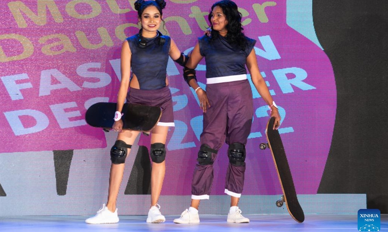 Models present creations during the Mother Daughter fashion show in Colombo, Sri Lanka, on May 29, 2022. The highlight of the show is that the designs are modeled by real mother-daughter duos. (Photo: Xinhua)