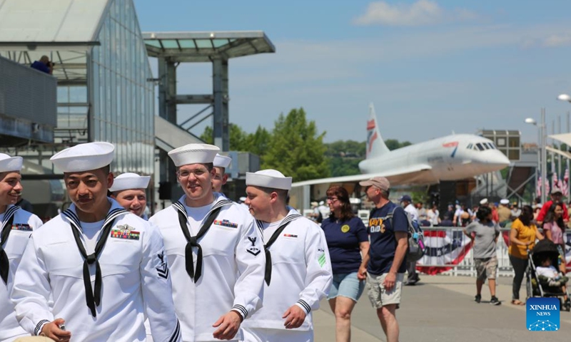 U.S. Navy sailors leave the venue after the conclusion of an event marking Memorial Day at the Intrepid Sea, Air and Space Museum in New York, the United States, on May 30, 2022. New Yorkers celebrated Memorial Day on Monday with parades and other activities, which resembled the celebrations in the time before the COVID pandemic.(Photo: Xinhua)