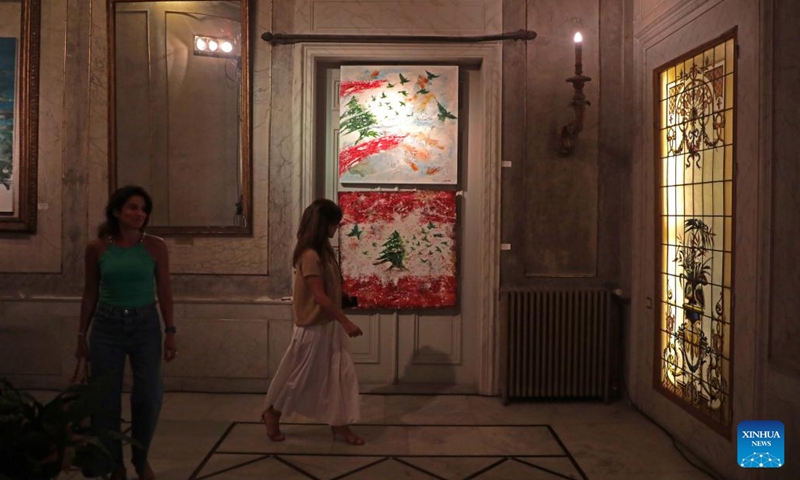 People visit a cedar art exhibition at Sursock Palace in Beirut, Lebanon, on May 30, 2022. The exhibition is aimed at raising funds to contribute to the restoration of Sursock Palace, which was damaged in the Beirut port explosions.(Photo: Xinhua)