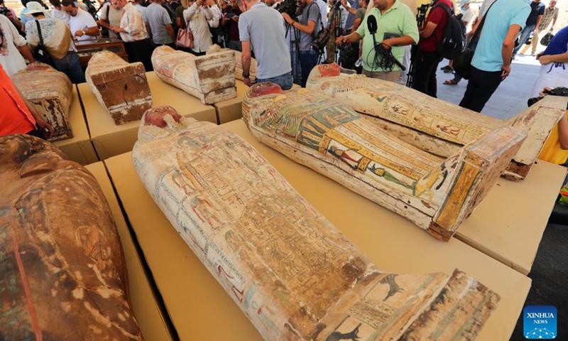 Photo taken on May 30, 2022 shows colored coffins containing mummies during an archaeological achievements exhibition at Saqqara necropolis, south of Cairo, Egypt. Egypt unveiled on Monday a major new archaeological find of 250 sealed coffins containing mummies, 150 bronze statues of ancient gods and goddesses, and other antiquities at the Saqqara necropolis, south of the capital Cairo.(Photo: Xinhua)