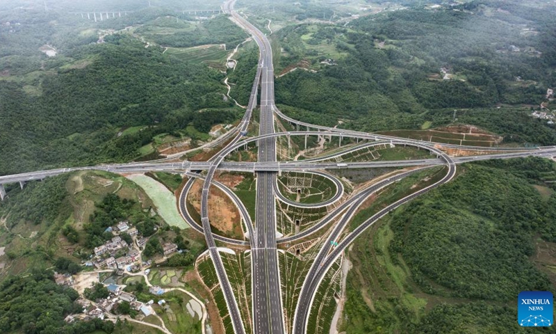 Aerial photo taken on May 31, 2022 shows cars running through the Shangzhai section of the Guiyang-Huangping Highway in southwest China's Guizhou Province. The Guiyang-Huangping Highway was opened to traffic on Tuesday, shortening the travel time between Guiyang City and Huangping County of Guizhou Province from the current 3.5 hours to just about one hour and 20 minutes. The main line of this highway stretches 120.6 kilometers and connects Guizhou with the Yangtze River Delta region.(Photo: Xinhua)