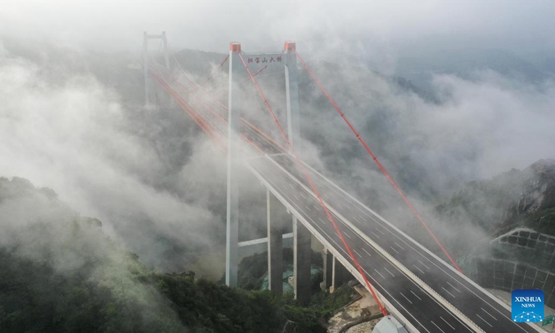 Aerial photo taken on May 31, 2022 shows the Yangbaoshan grand bridge along the Guiyang-Huangping Highway in southwest China's Guizhou Province. The Guiyang-Huangping Highway was opened to traffic on Tuesday, shortening the travel time between Guiyang City and Huangping County of Guizhou Province from the current 3.5 hours to just about one hour and 20 minutes. The main line of this highway stretches 120.6 kilometers and connects Guizhou with the Yangtze River Delta region.(Photo: Xinhua)