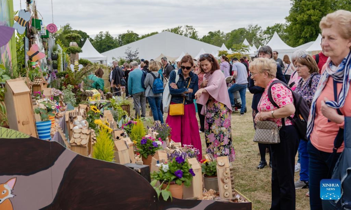 People visit a gardening festival in Dublin, Ireland, June 2, 2022. The 16th edition of Bord Bia Bloom, a national gardening and food festival in Ireland, opened here on Thursday, attracting a large number of visitors from home and abroad. (Photo by Liu Yanyan/Xinhua)