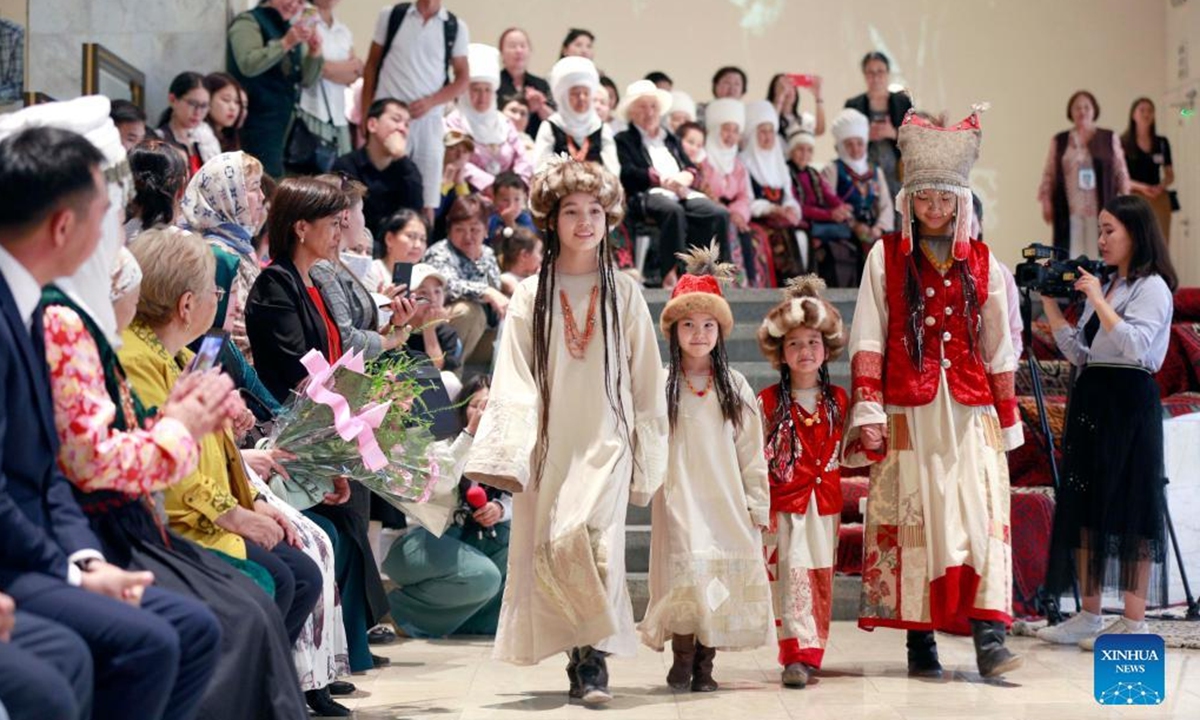 Kids participate in a fashion show displaying clothes of nomadic style to celebrate the International Children's Day in Bishkek, Kyrgyzstan, June 1, 2022. (Photo by Roman/Xinhua)