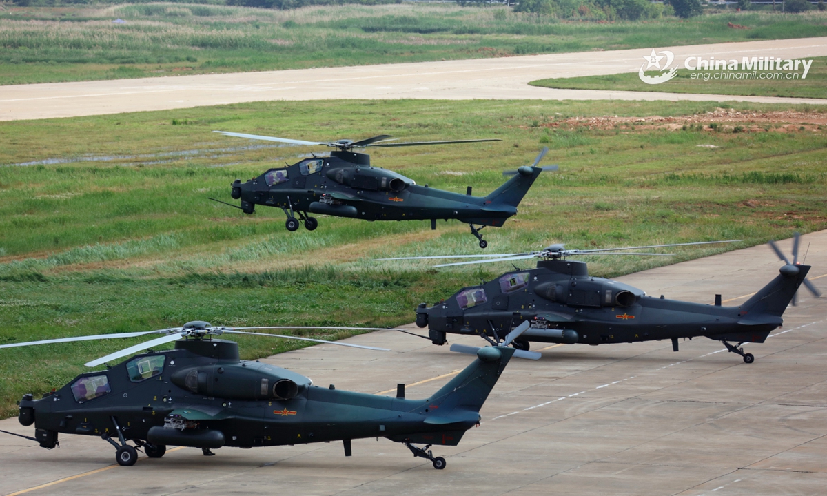 A group of attack helicopters attached to a brigade under the PLA 75th Group Army execute hover checks before leaving for a flight training task on May 25, 2022. (eng.chinamil.com.cn/Photo by Li Chunguo) 