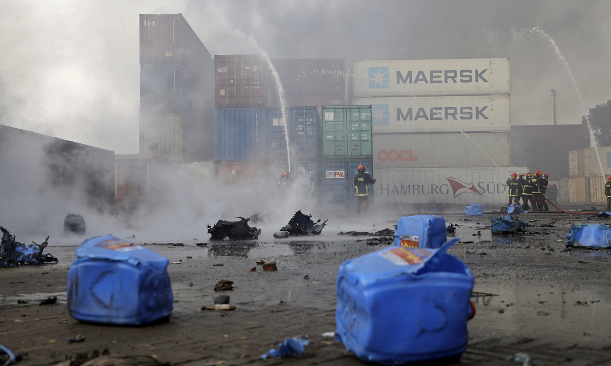 Firefighters try to extinguish a fire that broke out at a container storage facility in Sitakunda, about 40 kilometers from the key port of Chittagong, Bangladesh on June 5, 2022. Photo: AFP