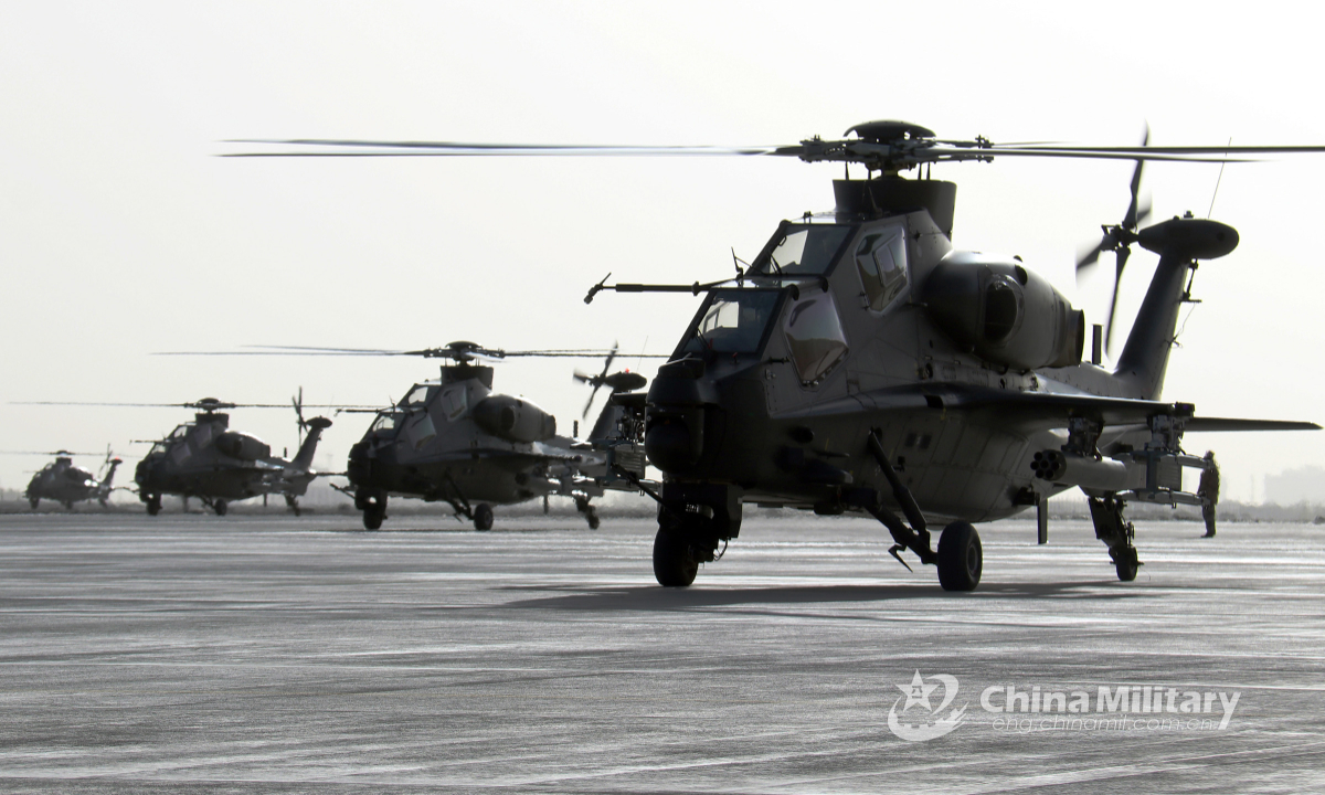 A group of helicopters attached to an army aviation brigade under the PLA 76th Group Army stand ready for lifting off in the specialized training on subjects of ultralow-altitude formation assault and rapid infiltration in the middle of May, 2022. (eng.chinamil.com.cn/Photo by Wu Xiaofeng)