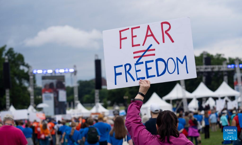 People gather during a rally decrying rising gun violence while urging politicians to take action in Washington, D.C., the United States, June 11, 2022. (Xinhua/Liu Jie)